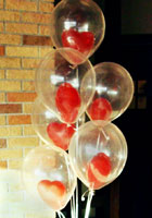 Букет красных сердец в прозрачных шарах с гелием к 14 февраля